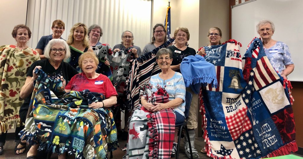 Supporting veterans in hospice by making lap blankets.
